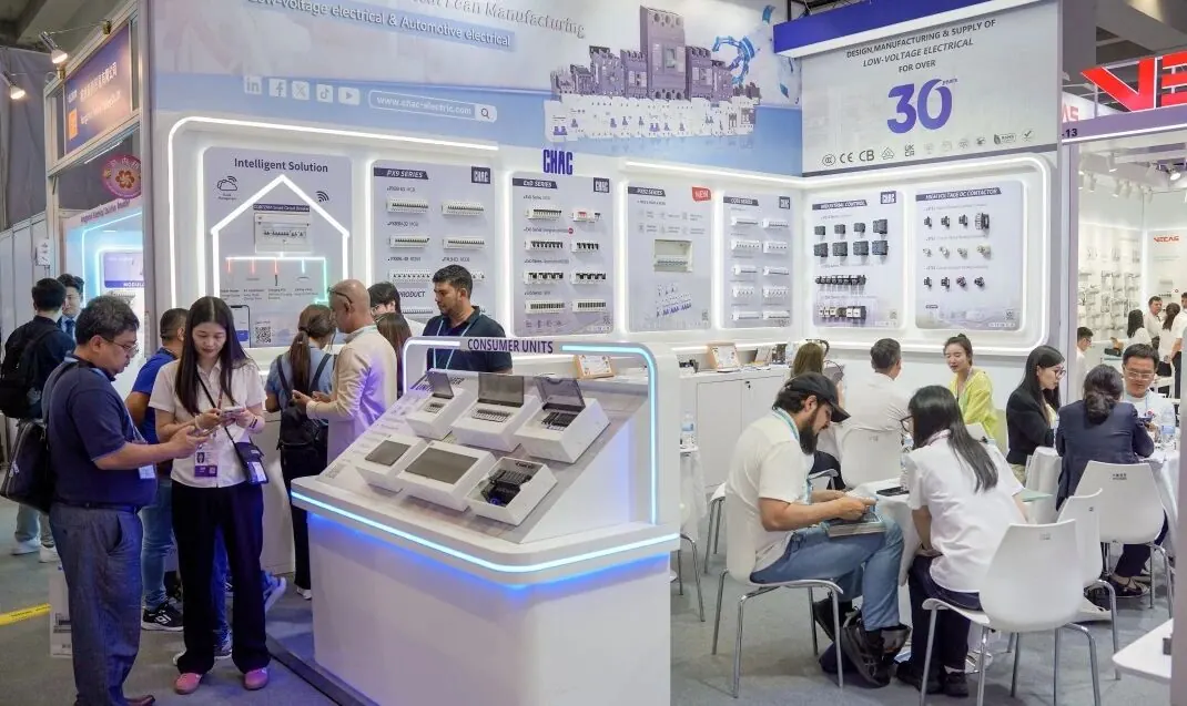 Visitors discussing low-voltage electrical products at the CHAC Electric Canton Fair booth