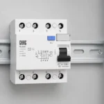 Electrician reviewing RCCB wiring and residual-current protection on a DIN rail